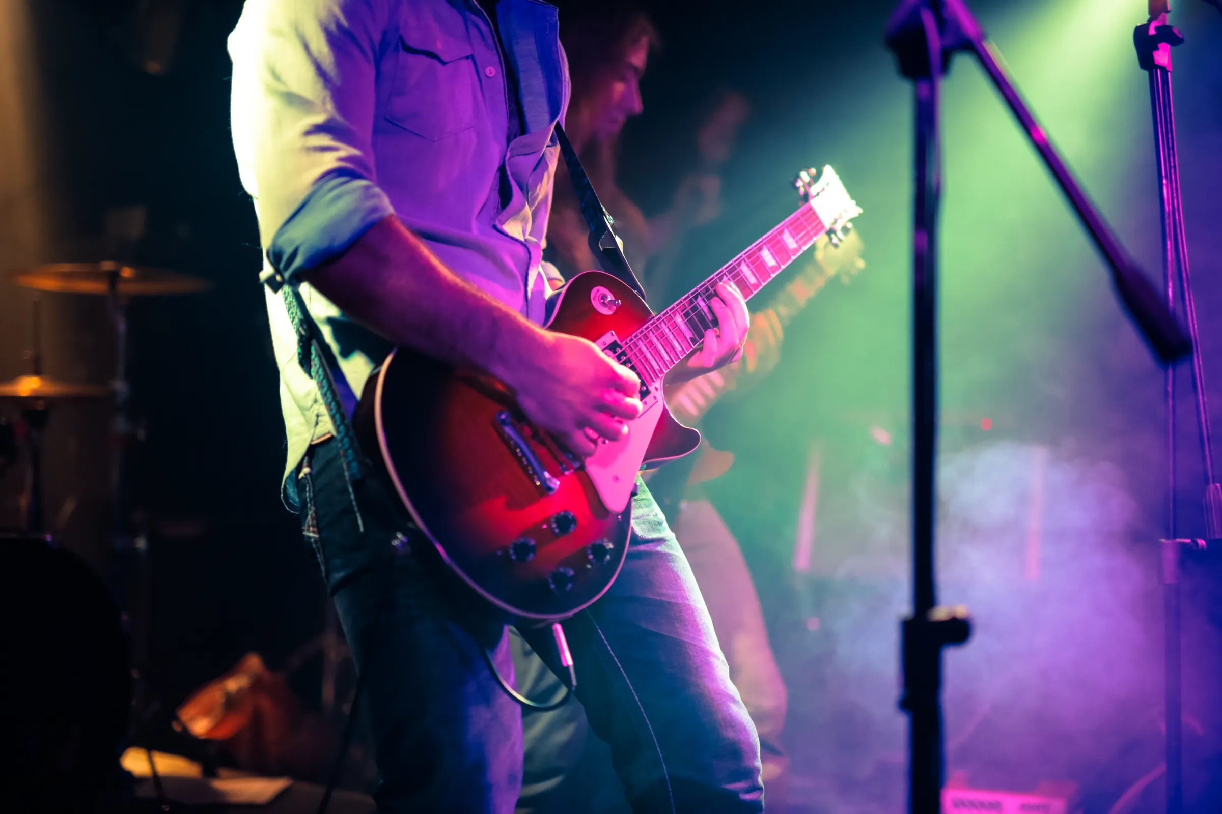 band member playing guitar