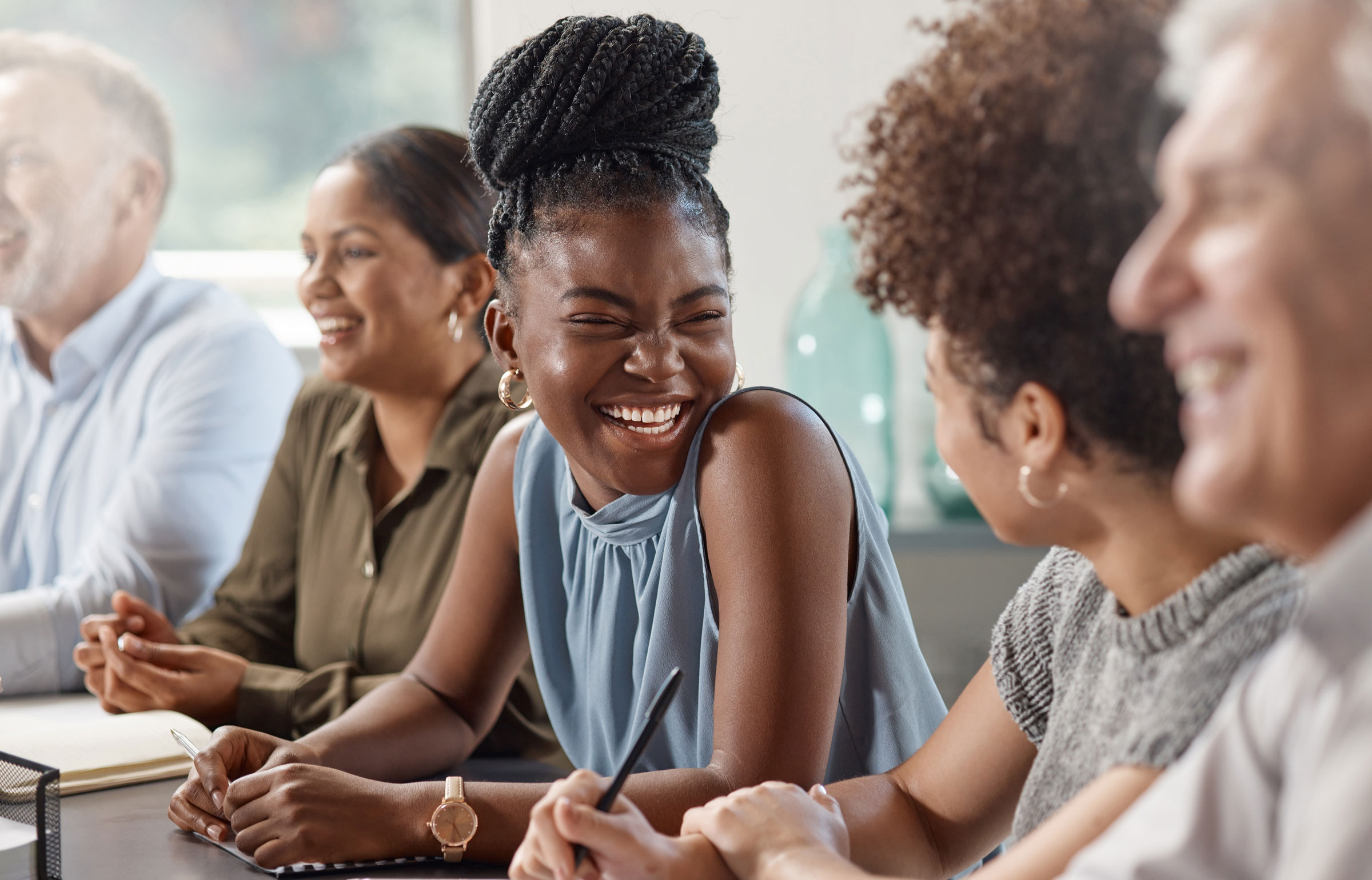 Woman laughing in meeting